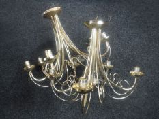 Two brass five-way light fittings with glass shades