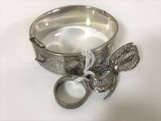 A silver hinged bangle,