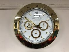 A contemporary 'Rolex' display wall clock