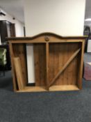 A set of pine arched topped open shelves