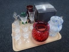 A tray of boxed cranberry Dartington Crystal vase and assorted glass ware