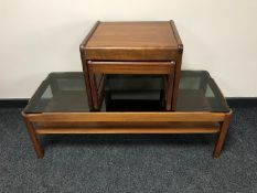 A teak Myers glass topped coffee table and nest of two teak tables