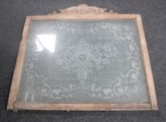 An antique etched glass window in frame CONDITION REPORT: 87cm by 68cm excluding