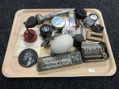 A tray of lacquered brass military compass, life boat matches, large egg,