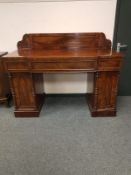 An early 19th century mahogany breakfronted pedestal sideboard,