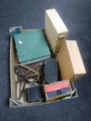 A box of slide boxes and slides, cased Prinz binoculars,