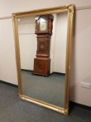 A gilt framed overmantel mirror,