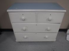 An early 20th century painted pine four drawer chest