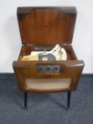 A mid 20th century walnut cased Dynatron Cavalcade model R1 record player with Garrard turn table