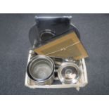 A crate of stainless steel bread bin, plated twin handled tray,