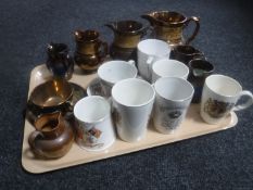 A tray of antique copper lustre jugs, tea cup and saucer,
