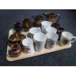 A tray of antique copper lustre jugs, tea cup and saucer,