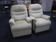 A pair of armchairs in sand coloured fabric