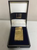 A Dunhill gold plated lighter,