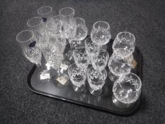 A tray of seventeen lead crystal and glass drinking glasses - six Stewart Crystal brandy glasses,