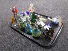 A tray of Murano and Mdina glass ware to include paperweights, fish ornaments, two dolphins,