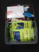 Two boxes of high visibility rain jackets, children's socks, caps,