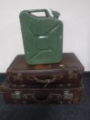 Two vintage leather luggage cases and a Jerry can