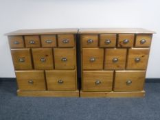 A pair of contemporary pine nine drawer chests