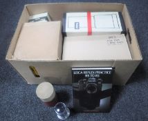 A box of two boxed Rollei lenses with accessories