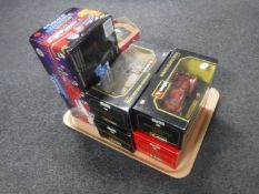 A tray of four boxed Burago 1/24 scale die cast cars,