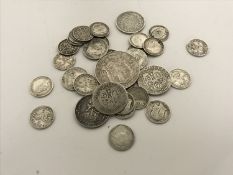 A bag of British silver coins - one shilling pieces, threepenny pieces,