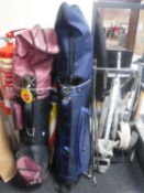 Two golf bags containing clubs,