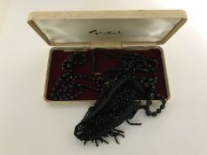 A box of two Whitby jet necklaces and a vintage beaded collar