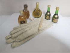 A box of vintage calf skin gloves, ivory letter opener,