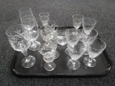 A tray containing assorted antique drinking glasses
