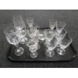 A tray containing assorted antique drinking glasses