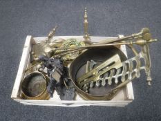 A crate of antique brass ware - fire dogs, companion pieces, coal bucket,