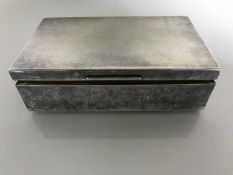 A silver cigarette box
