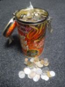 A tin of foreign coinage