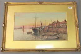 Fred Fitch : Fishing boats at low tide by a quay, watercolour, signed, 30 cm x 53 cm, framed.