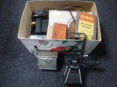 A box of early enlarger, folding camera with accessories,
