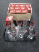A tray of eight unboxed Coca Cola glasses together with a further twelve boxed limited edition