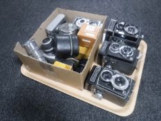 A tray of three twin lens cameras, two Werna cameras,