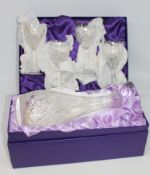 A boxed Edinburgh crystal decanter and set of four wine glasses