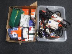 A box and a crate of car parts - wheel bearing kit, fan belts,
