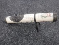 An ornate Chinese resin and metal table pipe