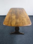 An Ercol elm refectory dining table
