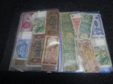 A folder containing banknotes of the world