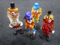 Four Murano glass clowns