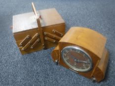 A mid 20th century concertina sewing box and a walnut cased mantel clock