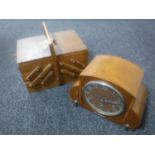 A mid 20th century concertina sewing box and a walnut cased mantel clock