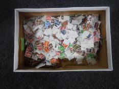 Two boxes of loose British and foreign stamps