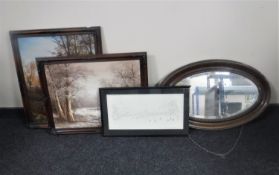 An oval mahogany framed mirror,