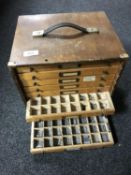 A mid 20th century desk top nine drawer printer's type chest and type pieces