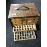 A mid 20th century desk top nine drawer printer's type chest and type pieces